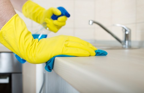 Professional house clearance service sorting items inside an Uxbridge property